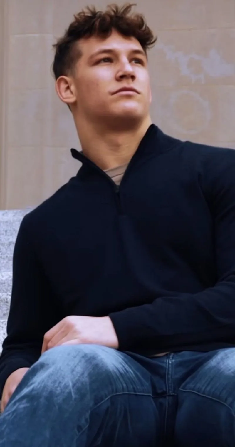 Jake in a 34 Heritage quarter-zip and jeans